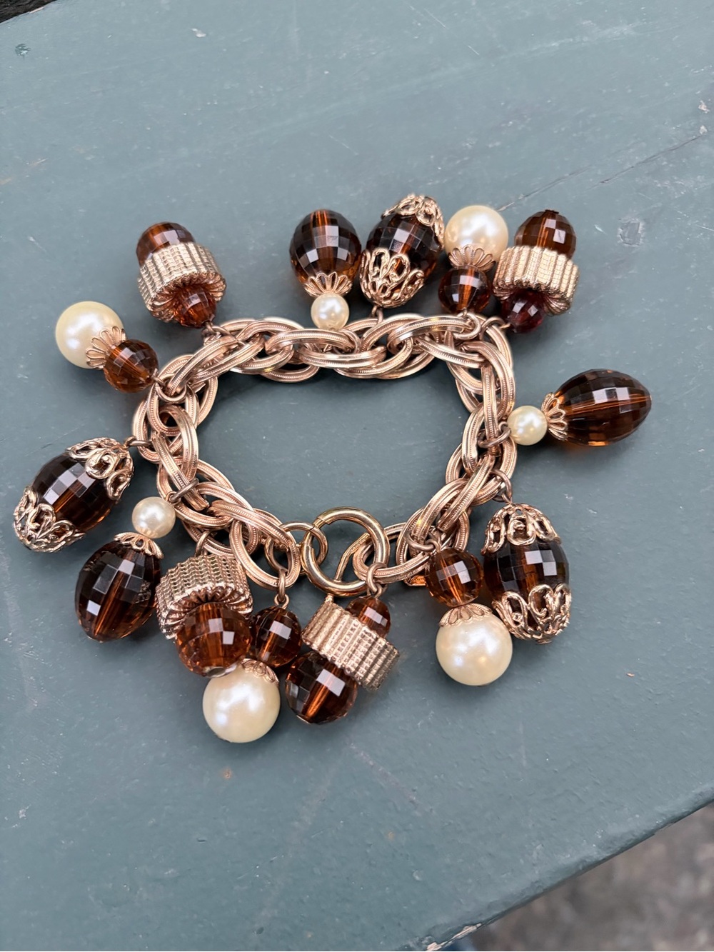 Napier Gold-Tone Charm Bracelet with Amber Beads and Pearl Drops